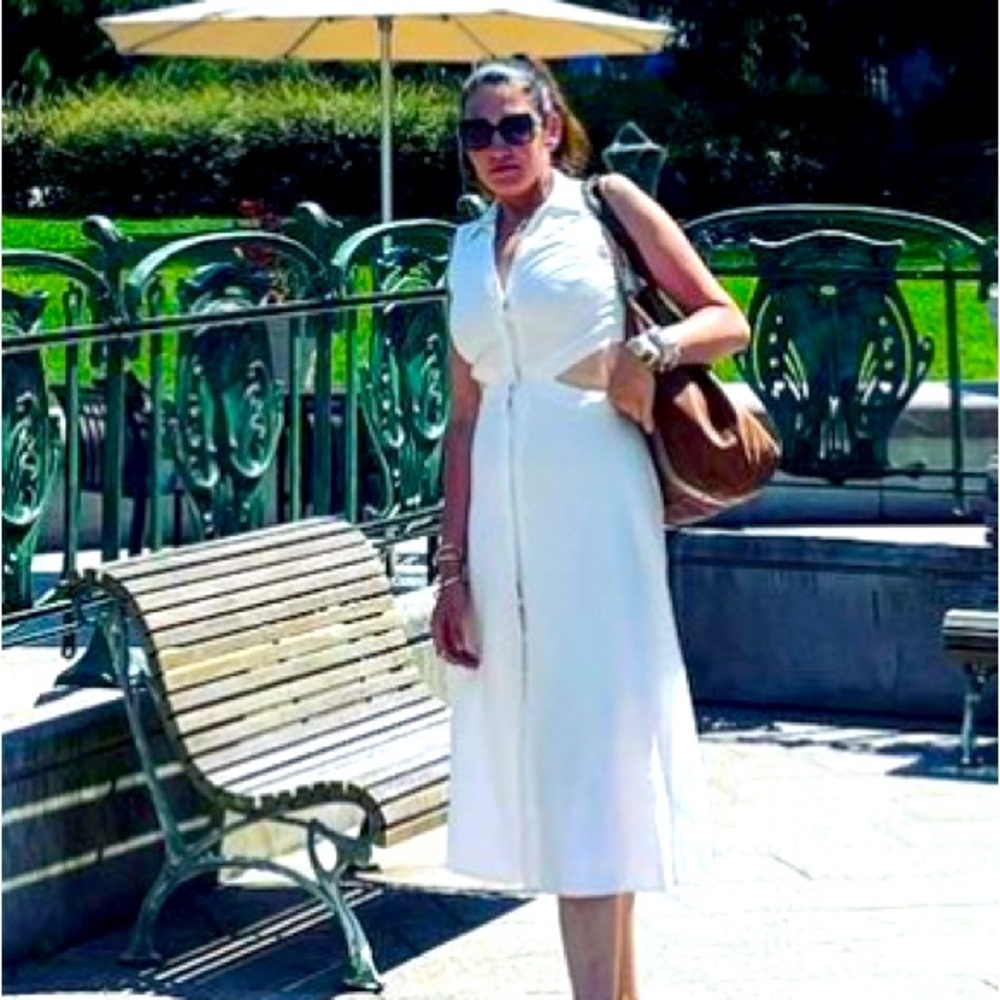 All white linen dress with. Cut outs